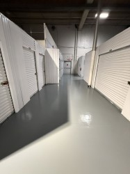 Endura-Plate topcoat over damaged tile floors in hallway.